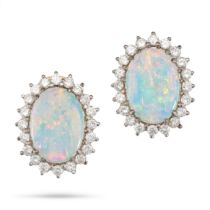 A PAIR OF OPAL AND DIAMOND CLUSTER EARRINGS in 18ct yellow and white gold, each set with an oval ...