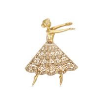 A DIAMOND DANCER BROOCH / PENDANT in yellow gold, designed as a dancer with an openwork skirt, th...