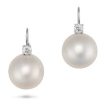 A PAIR OF PEARL AND DIAMOND EARRINGS in white gold, each set with a round brilliant cut diamond s...