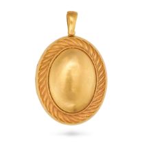 AN ANTIQUE LOCKET PENDANT in yellow gold, the oval hinged locket with a scrolling border, opening...