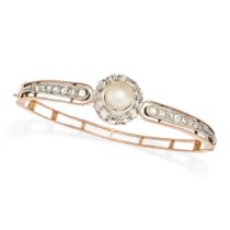 AN ANTIQUE NATURAL SALTWATER PEARL AND DIAMOND BANGLE in rose gold and silver, the hinged bangle ...
