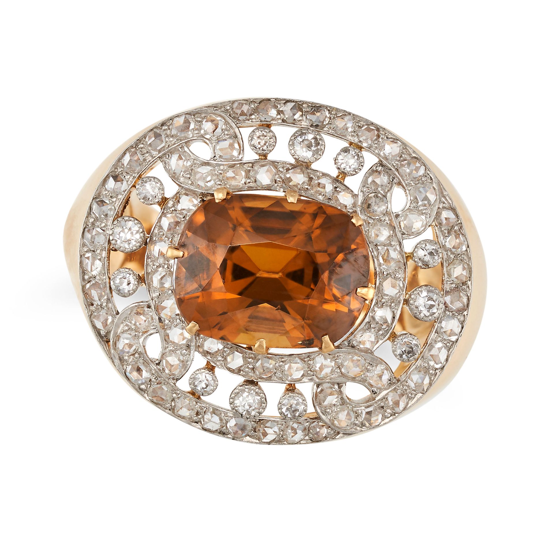 A GOLDEN ZIRCON AND DIAMOND DRESS RING in yellow gold, set with a cushion cut golden zircon in an...