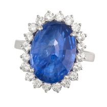 A SAPPHIRE AND DIAMOND RING in 18ct white gold, set with an oval faceted sapphire of approximatel...