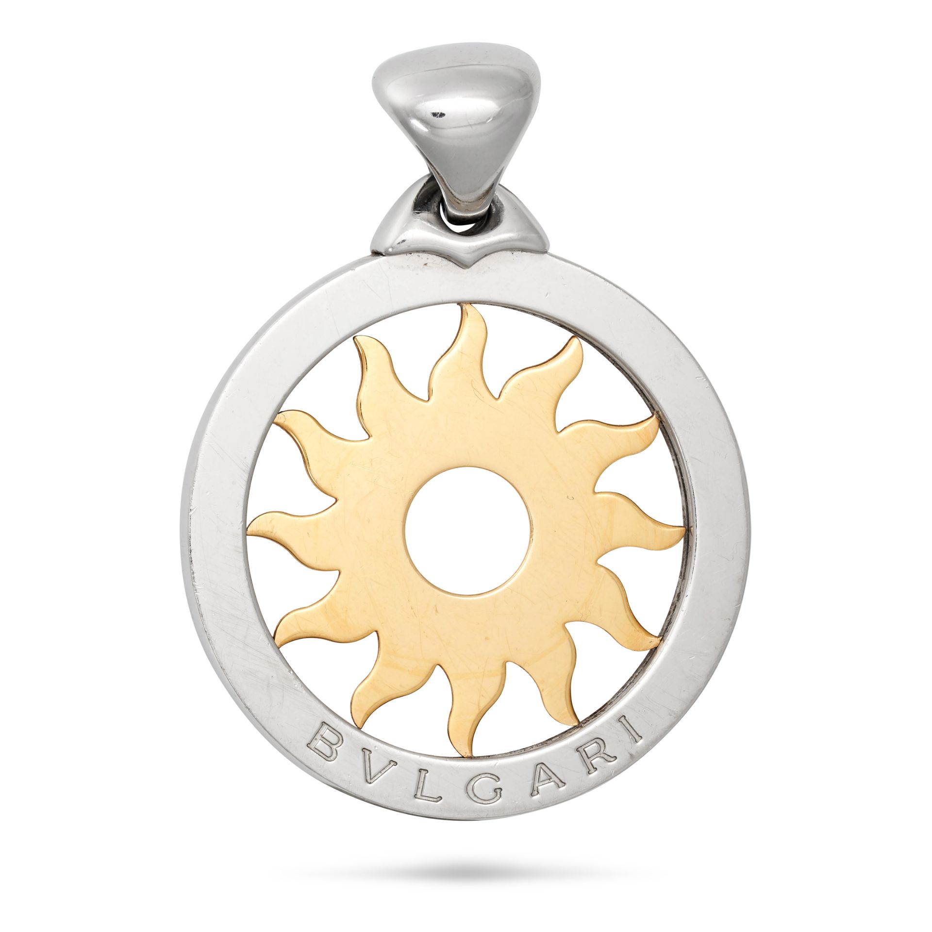 BULGARI, A TONDO SUN PENDANT in 18ct yellow gold and steel, the circular pendant designed as an o...
