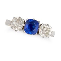 A SAPPHIRE AND DIAMOND THREE STONE RING in yellow gold and platinum, set with a cushion cut sapph...