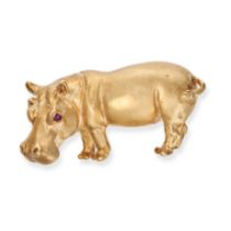 A RUBY HIPPOPOTAMUS BROOCH in 9ct yellow gold, designed as a hippopotamus with ruby eyes, H G mak...