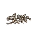 AN ANTIQUE DIAMOND FLORAL SPRAY BROOCH in yellow gold and silver, designed as a floral spray set ...