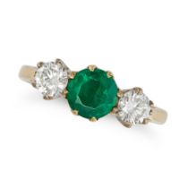 AN EMERALD AND DIAMOND THREE STONE RING in 18ct yellow gold, set with a round cut emerald between...