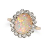 AN OPAL AND DIAMOND CLUSTER RING in yellow gold, set with an oval cabochon opal in a cluster of s...