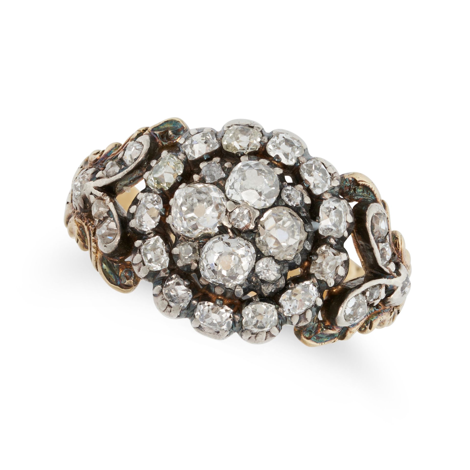 AN ANTIQUE DIAMOND CLUSTER RING in yellow gold and silver, set with a cluster of old cut diamonds...