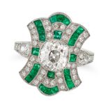 A DIAMOND AND EMERALD DRESS RING in platinum, set to the centre with an old cut diamond of approx...