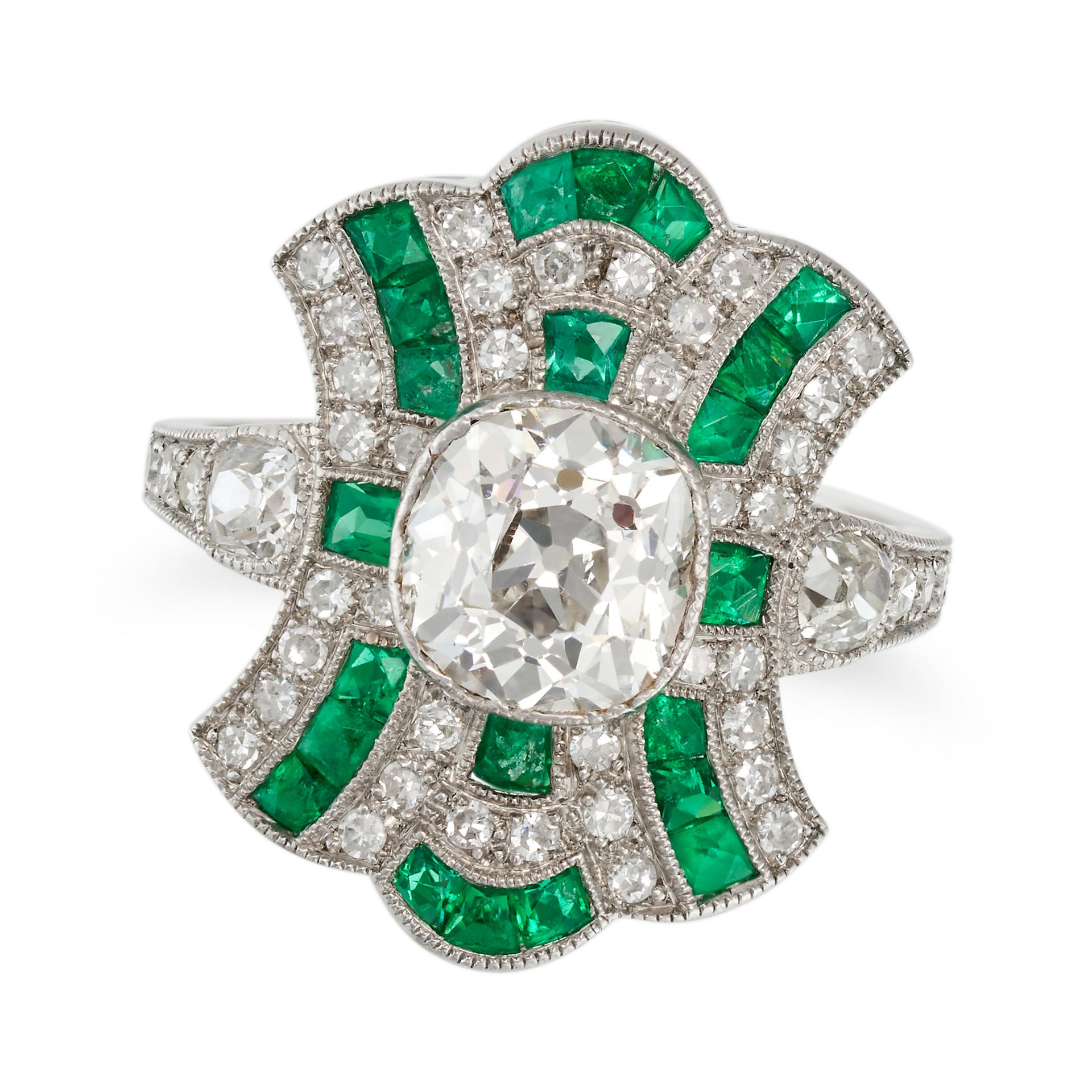 A DIAMOND AND EMERALD DRESS RING in platinum, set to the centre with an old cut diamond of approx...