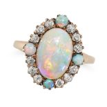 AN ANTIQUE OPAL AND DIAMOND RING in yellow gold, set with an oval cabochon opal in a border of ol...