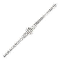 A DIAMOND BRACELET in 18ct white gold, comprising a cluster of round brilliant cut diamonds, acce...