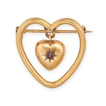 AN ANTIQUE RUBY HEART BROOCH in yellow gold, designed as an openwork heart, suspending a heart sh...