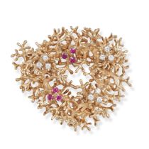 A MODERNIST RUBY AND DIAMOND BROOCH in 9ct yellow gold, designed as a stylised coral set with tri...