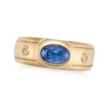A SAPPHIRE AND DIAMOND GYPSY RING in yellow gold, set with an oval cut sapphire accented on each ...