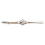 A DIAMOND THREE STONE BAR BROOCH in 15ct white gold, set to the centre three old cut diamonds wit...