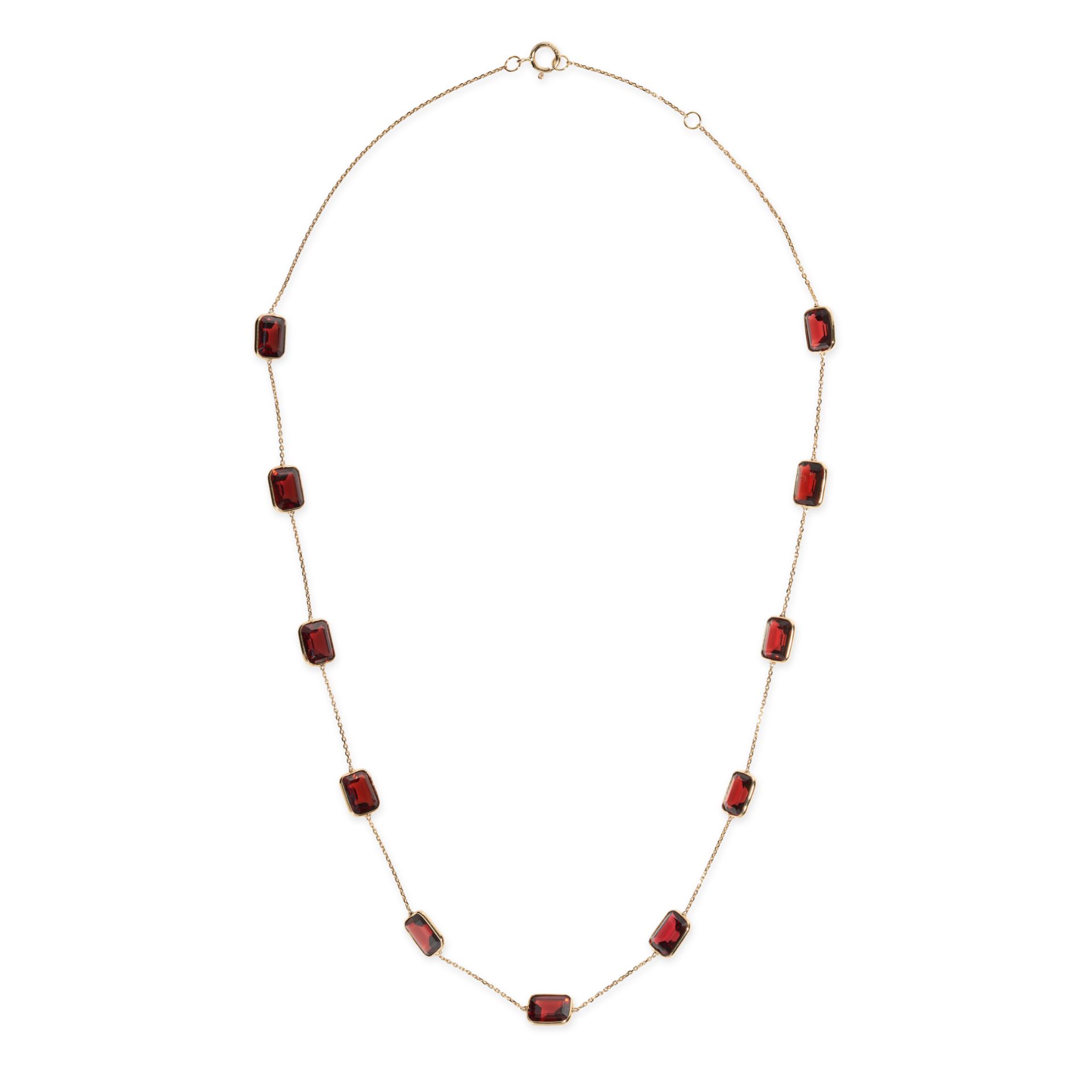 A GARNET NECKLACE in 18ct yellow gold, comprising a trace chain set with octagonal step cut garne...