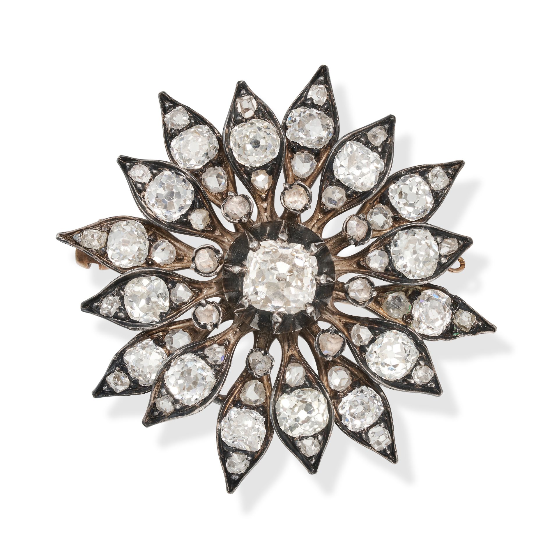 AN ANTIQUE DIAMOND FLOWER BROOCH in yellow gold and silver, designed as an articulated flower, se...