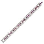 A RUBY AND DIAMOND BRACELET in 18ct white gold, comprising a row of bevelled links pave set with ...