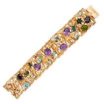 A MODERNIST GEMSET BRACELET in 14ct yellow gold, comprising textured openwork panels, accented va...