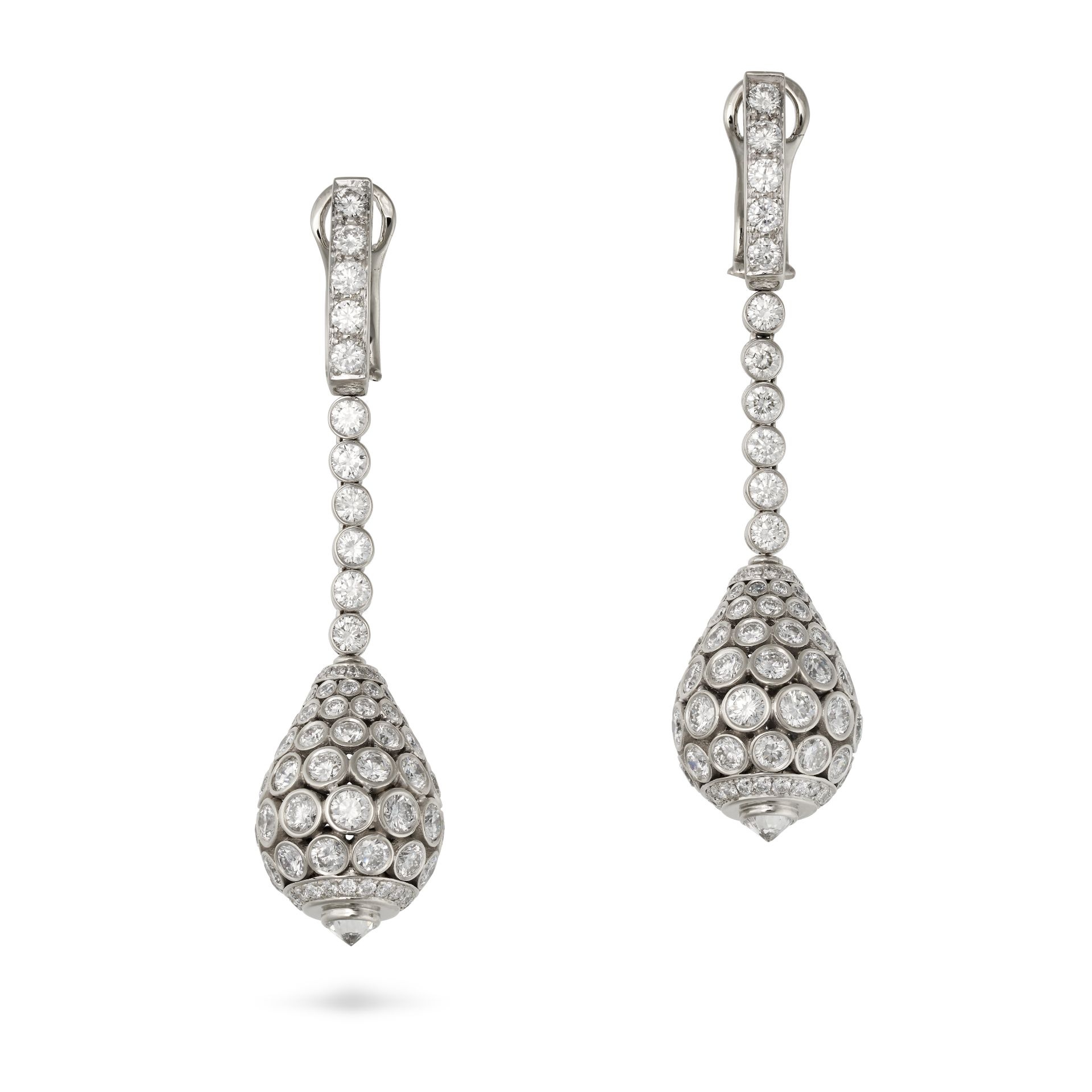 CARTIER, A FINE PAIR OF DIAMOND TAJ MAHAL EARRINGS in platinum, each comprising a row of round br...