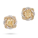 A PAIR OF FANCY YELLOW DIAMOND STUD EARRINGS in 18ct white and yellow gold, each set with a cut c...