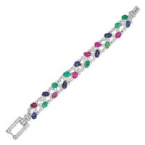 AN ART DECO TUTTI FRUTTI GEMSET BRACELET in platinum, the bracelet in foliate design set througho...