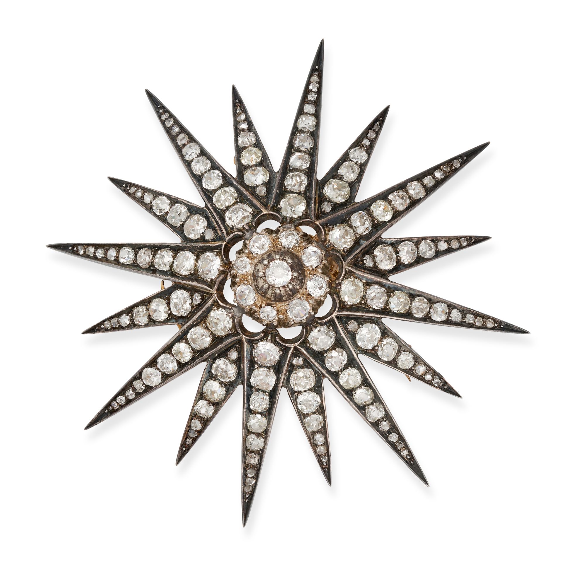 A FINE ANTIQUE DIAMOND STAR BROOCH / PENDANT, 19TH CENTURY in yellow gold and silver, designed as...