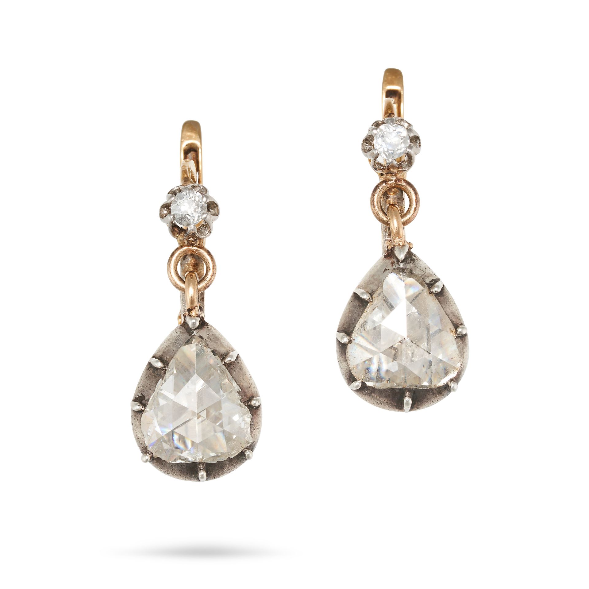 A PAIR OF DIAMOND DROP EARRINGS in yellow gold and silver, each set with an old cut diamond suspe...