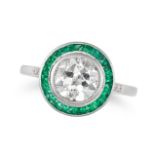 A DIAMOND AND EMERALD TARGET RING in 18ct white gold, set with an old cut diamond of 1.68 carats ...