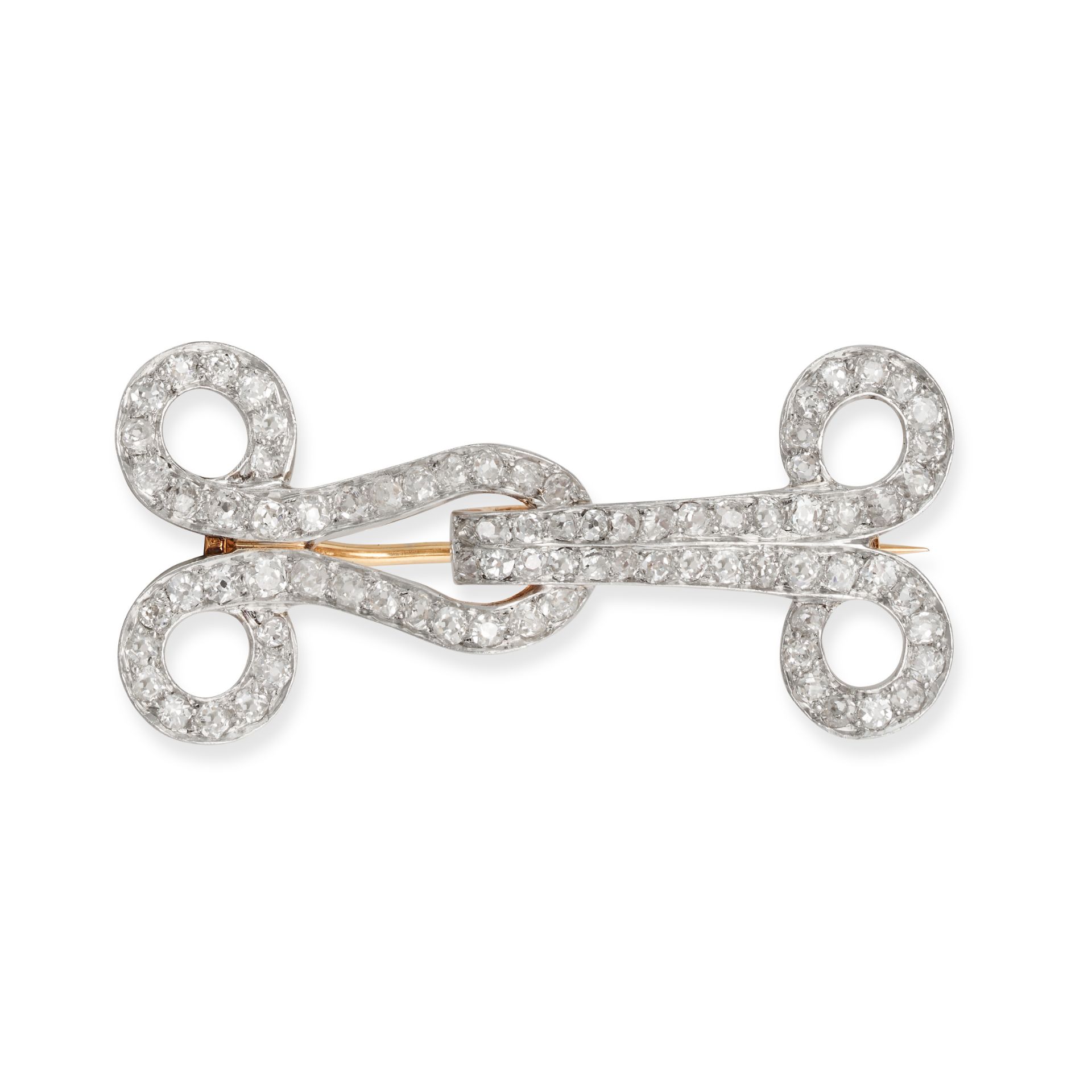 TIFFANY & CO., A DIAMOND BROOCH in 18ct white and yellow gold, the scrolling brooch set throughou...
