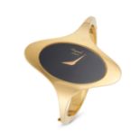 CHOPARD - A CHOPARD ELLIPSE BANGLE WATCH in 18ct yellow gold, 5038, the oval black dial with exag...