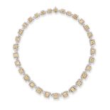 A YELLOW AND WHITE DIAMOND CLUSTER NECKLACE in platinum and 18ct yellow gold, comprising graduati...