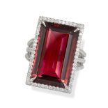 A PINK TOURMALINE AND DIAMOND DRESS RING in 18ct white gold, set with a rectangular step cut pink...