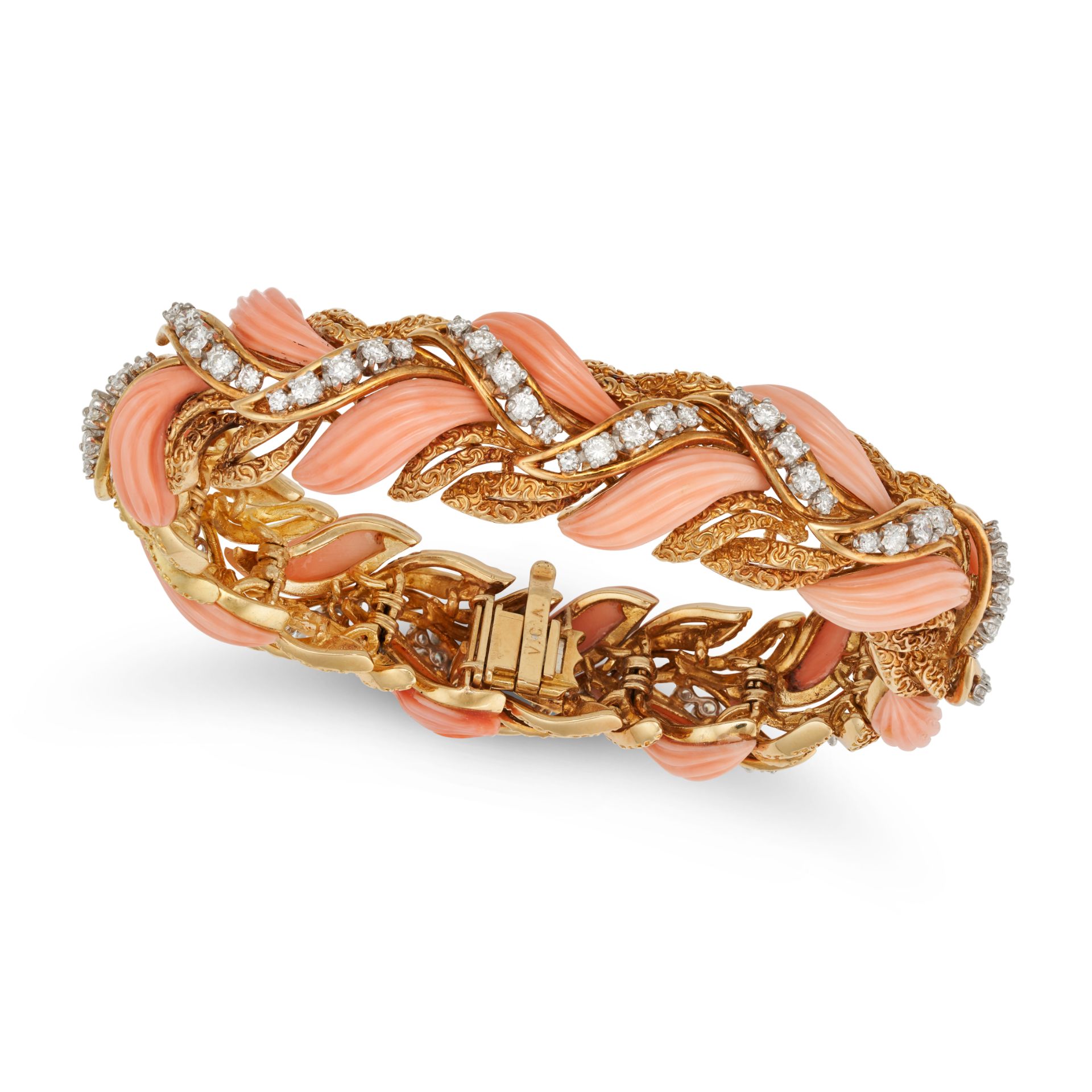 A CORAL AND DIAMOND BRACELET in yellow gold, the foliate style bracelet set with carved coral, ac...