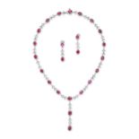 A BURMESE RUBY AND DIAMOND NECKLACE AND EARRINGS SUITE in 18ct white gold, the necklace set with ...