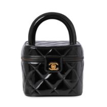 CHANEL, A VINTAGE BLACK PATENT LEATHER VANITY BAG Condition grade B. Produced between 1996 and ...