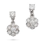 A PAIR OF DIAMOND CLUSTER EARRINGS in white gold, each set with a round brilliant cut diamond sus...