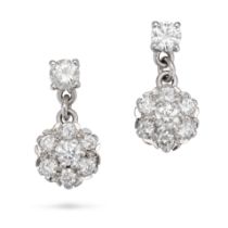 A PAIR OF DIAMOND CLUSTER EARRINGS in white gold, each set with a round brilliant cut diamond sus...