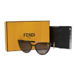 FENDI BLACK CAT EYE SUNGLASSES Condition grade B+. Black and pink toned sunglasses with rounded...