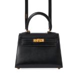 HERMES, A RARE VINTAGE BLACK BOX LEATHER MINI KELLY 20 Condition grade B-. 19.5cm long, 15cm hi...