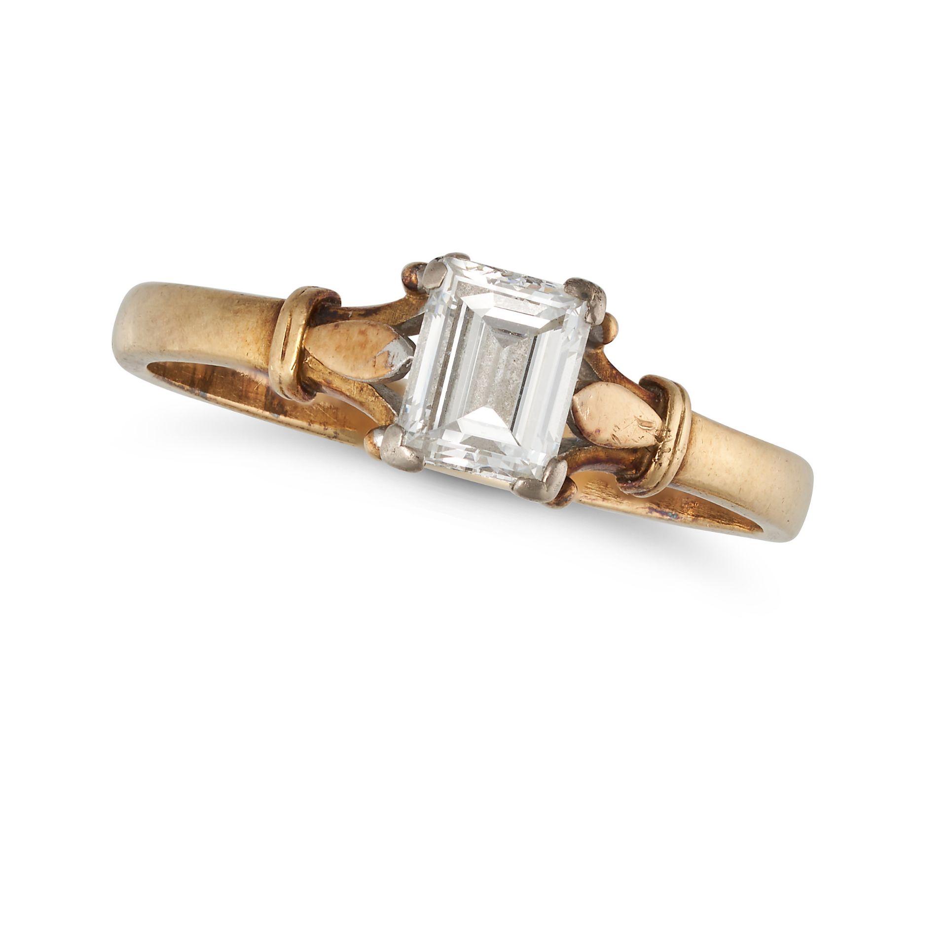 A SOLITAIRE DIAMOND RING in 18ct yellow gold, set with an emerald cut diamond of approximately 0....