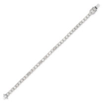 A DIAMOND LINE BRACELET in 18ct white gold, comprising a row of round brilliant cut diamonds all ...