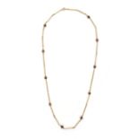 A BEADED NECKLACE in yellow gold, tigers eye beads integrating, clasp stamped 9CT, 66.0cm, 25.8g.