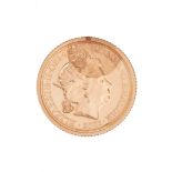 A GIBRALTAR COIN in yellow gold, bearing the late Queen Elizabeth II to one side and the other de...