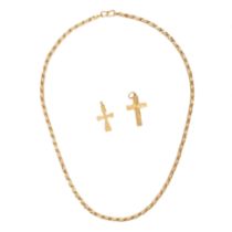 A CHAIN AND TWO CROSS PENDANTS in yellow gold, two cross pendants, one stamped 916, one 916, chai...