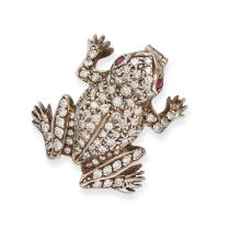 A DIAMOND AND RUBY FROG BROOCH designed as a frog set throughout with round cut diamonds, the eye...