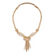 A DIAMOND FRINGE NECKLACE in 14ct yellow gold, comprising a series of stylised strands leading to...